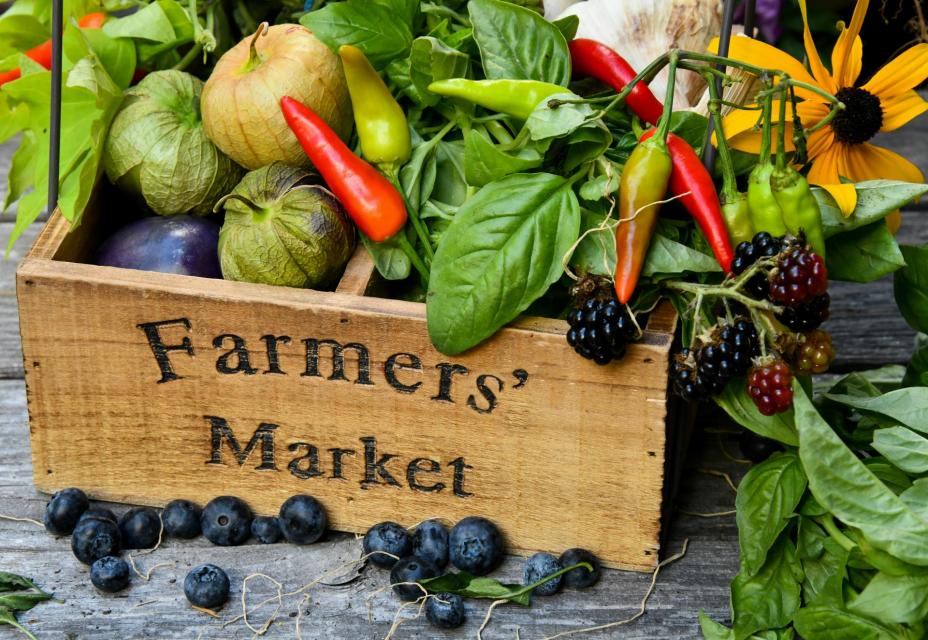A  box of fresh fruits and vegetables at a Farmers' Market