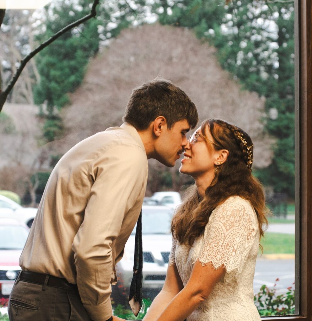 Couple Nathan and Sarah sharing a special moment during their wedding ceremony.